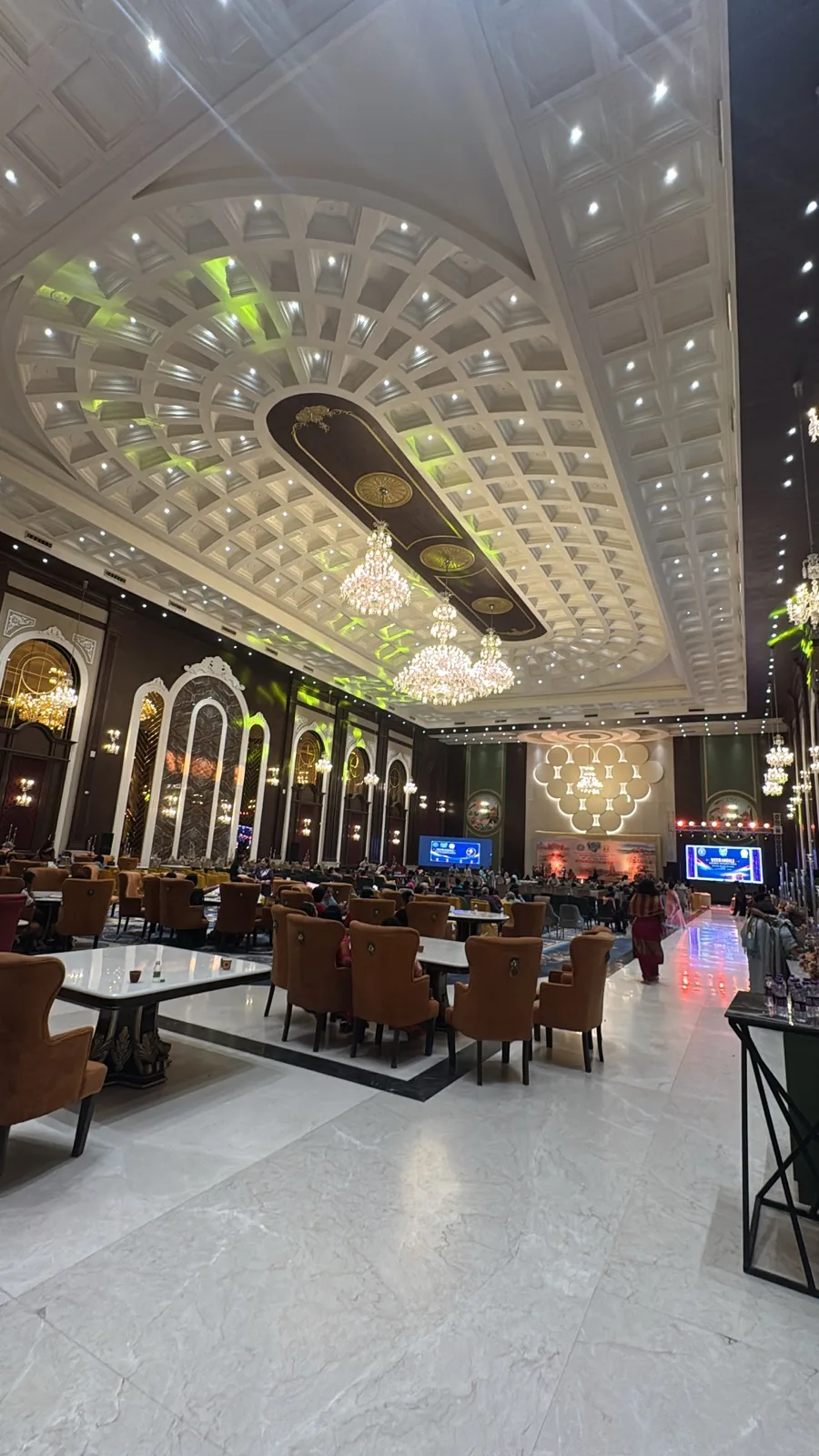Riviera's grand hall with chandeliers, vaulted detailing and banquet seating